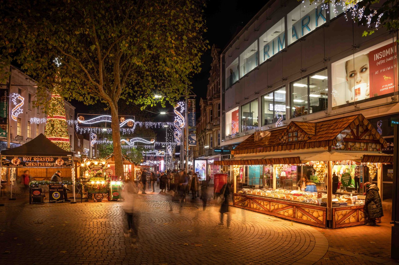 Reading High Street at night with Christmas lights and market